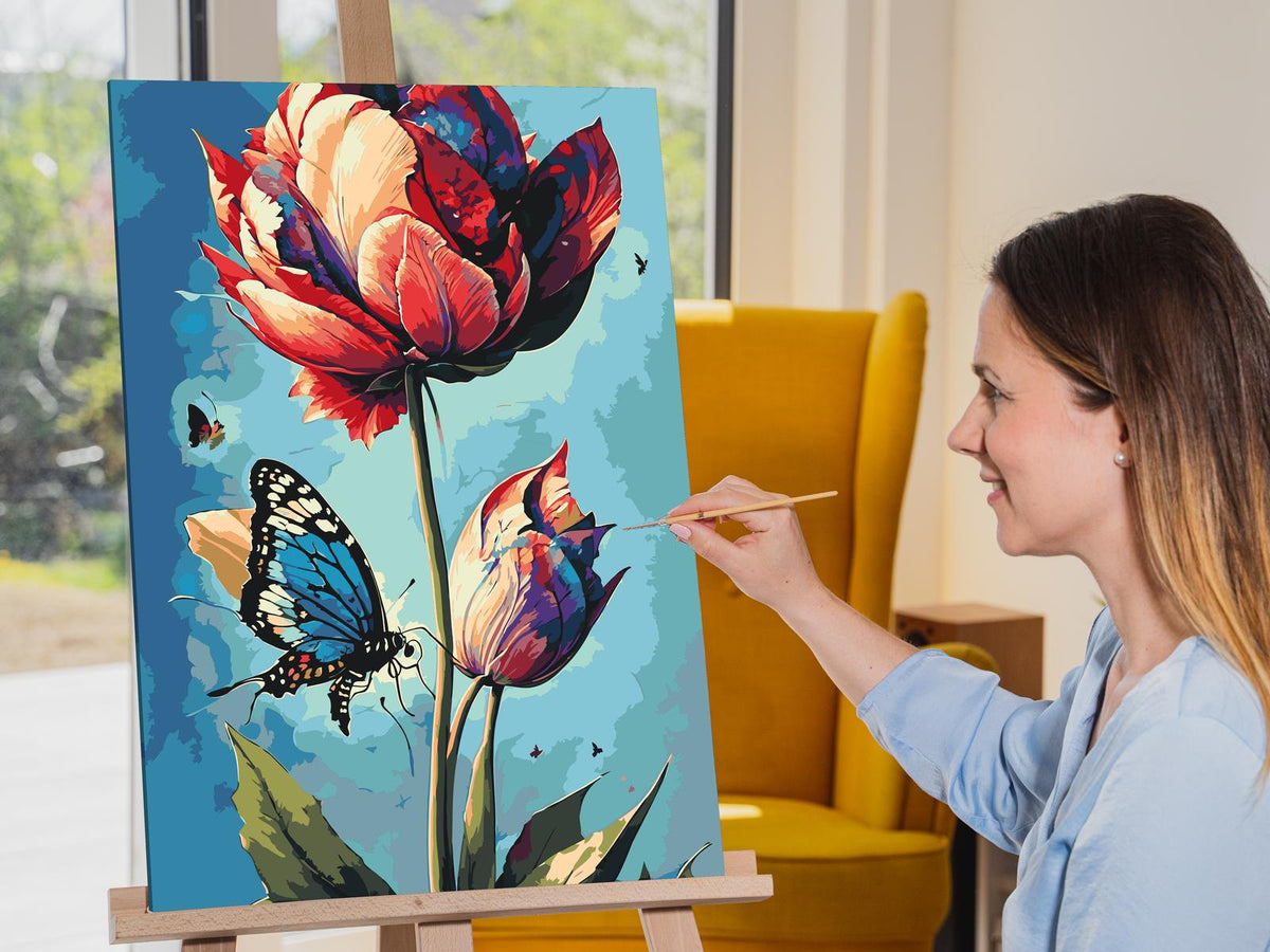 Paint by number - En blå sommerfugl og farverig tulipan